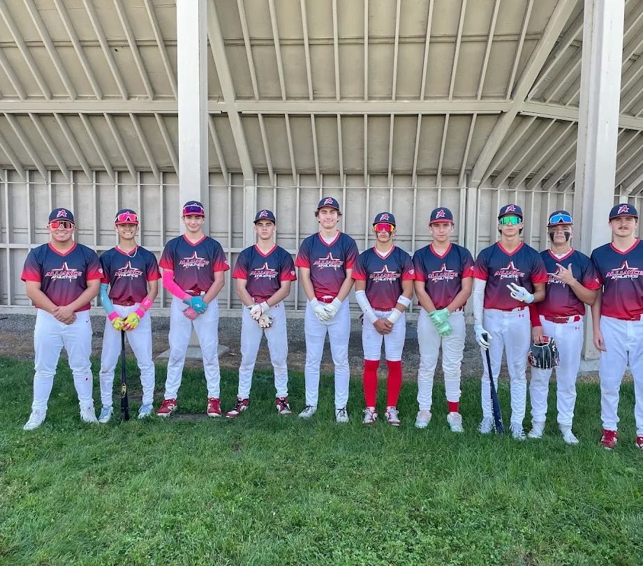 Athletic alliance baseball team wearing custom sublimated red and and navy jerseys by Final Game Sports in Tracy California