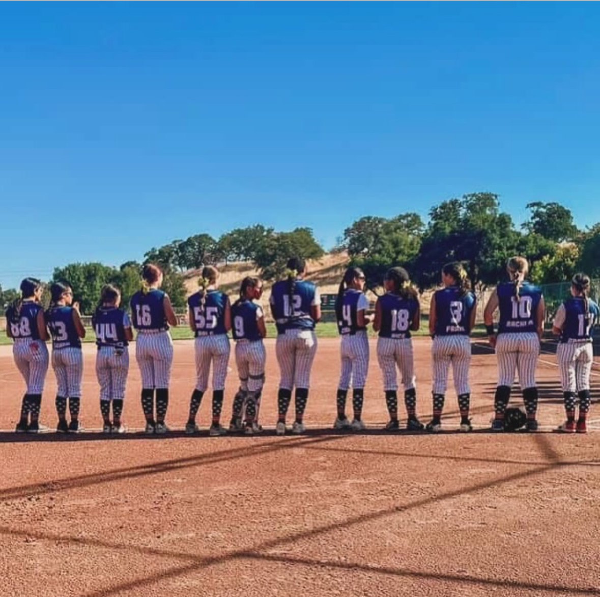 Fremont Centerville softball team wearing custom sublimated sleeveless all star jerseys by Final Game Sports in Tracy, California