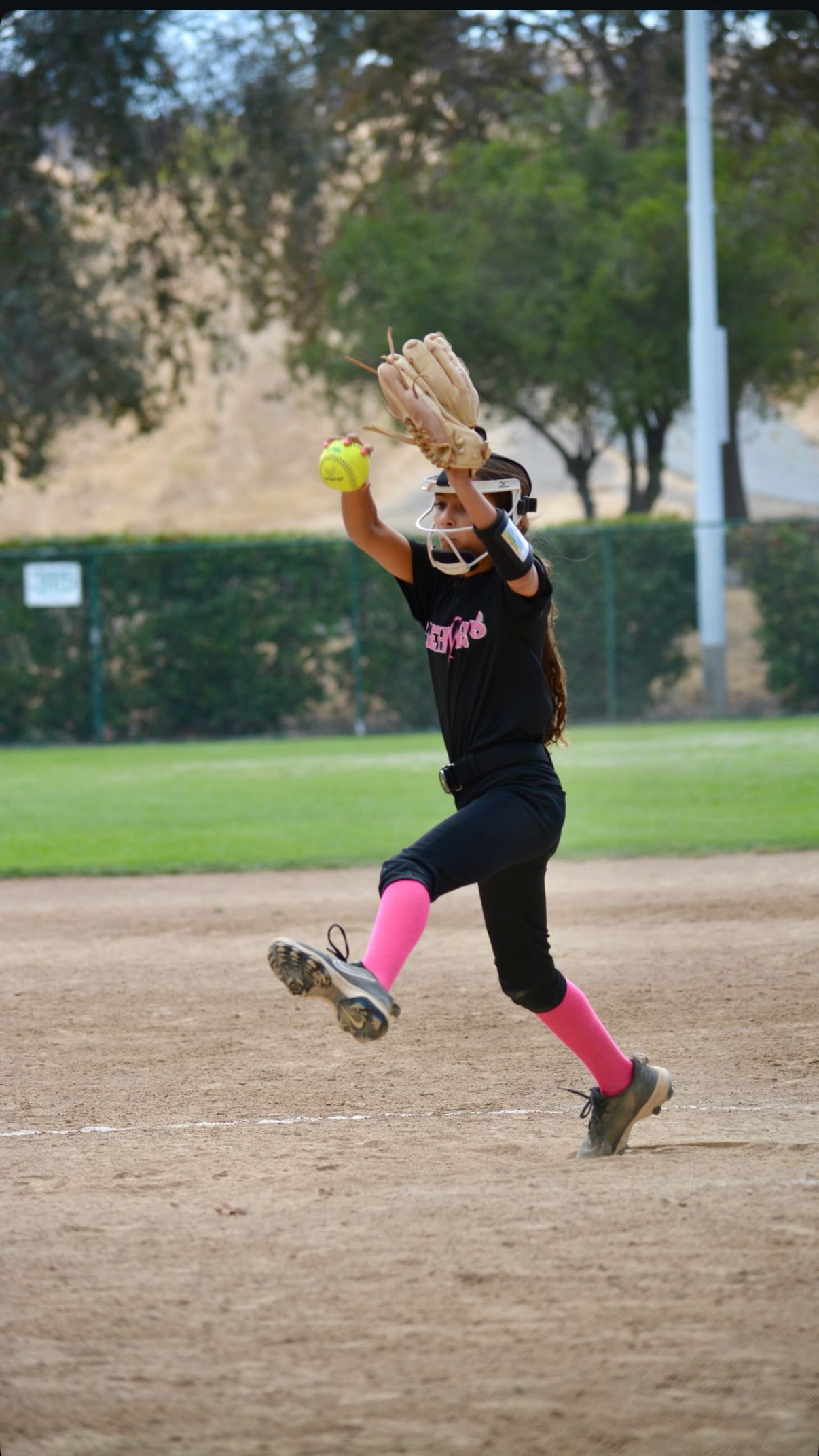 all american softball baseball team wearing custom sublimated black and pink jerseys by Final Game Sports in Tracy California